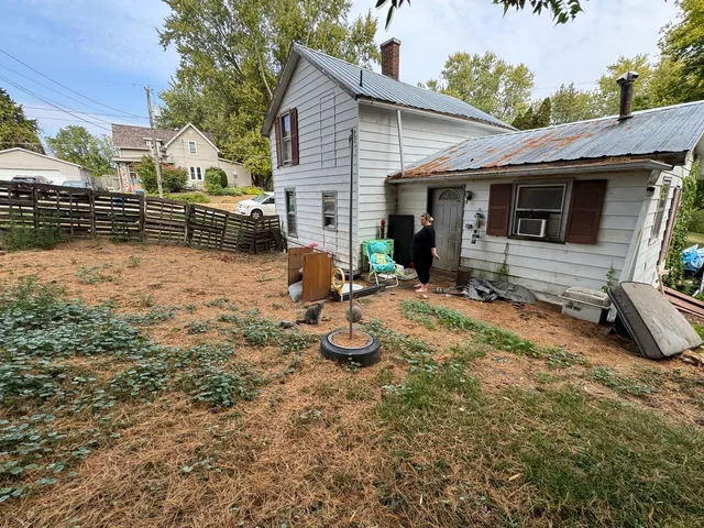 a view of a backyard with sitting area and furniture