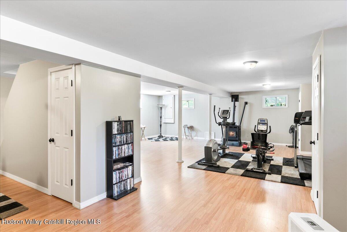 29 Stone Mountain Road Round Top, NY 12473 - Photo 28 of 36 a living room with furniture and a wooden floor