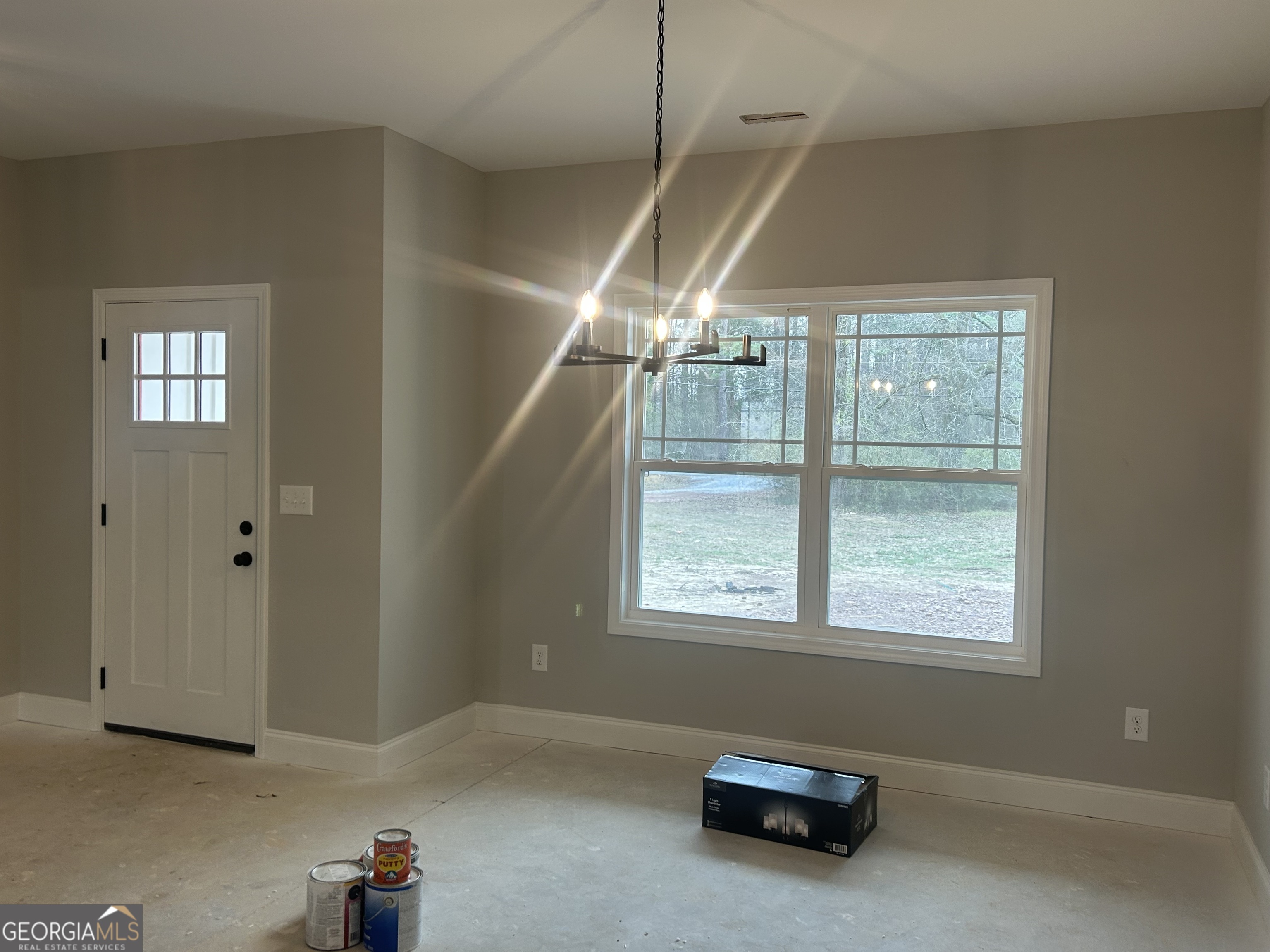 631 Old Summerville Road Northwest Rome, GA 30165 - Photo 21 of 22 a room with window and a chandelier