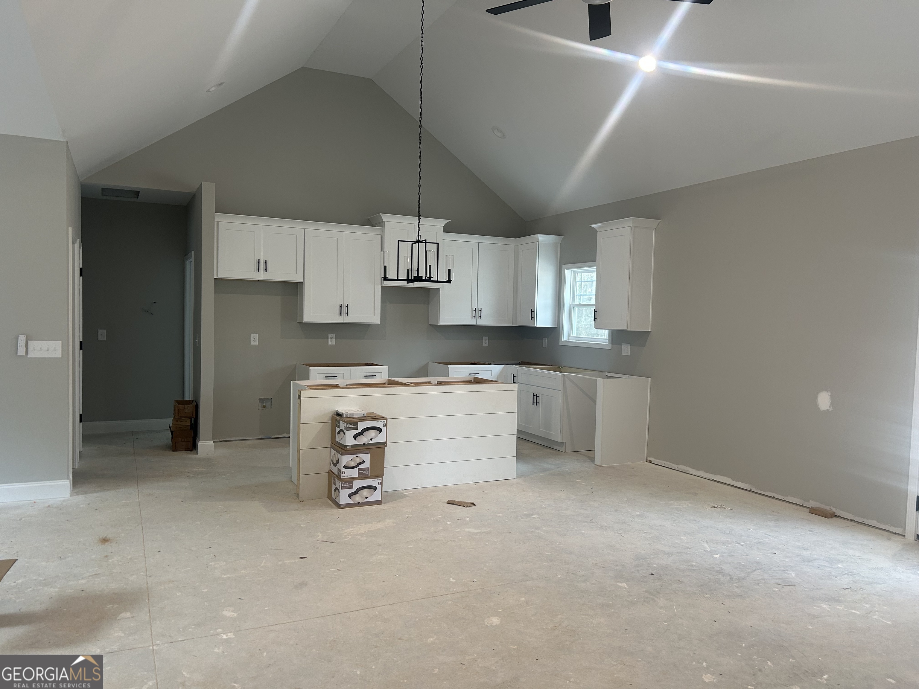 631 Old Summerville Road Northwest Rome, GA 30165 - Photo 9 of 22 a kitchen with stainless steel appliances a stove a sink and white cabinets