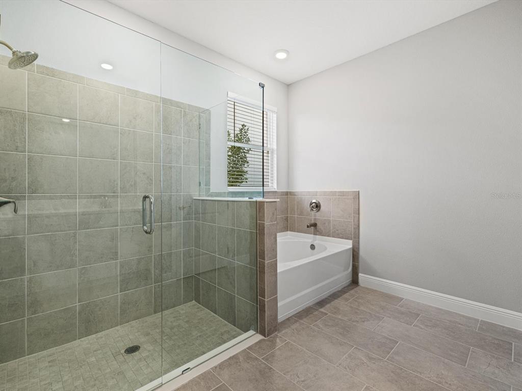 17707 Gulf Rnch Place Bradenton, FL 34211 - Photo 18 of 27 a bathroom with a bathtub and shower