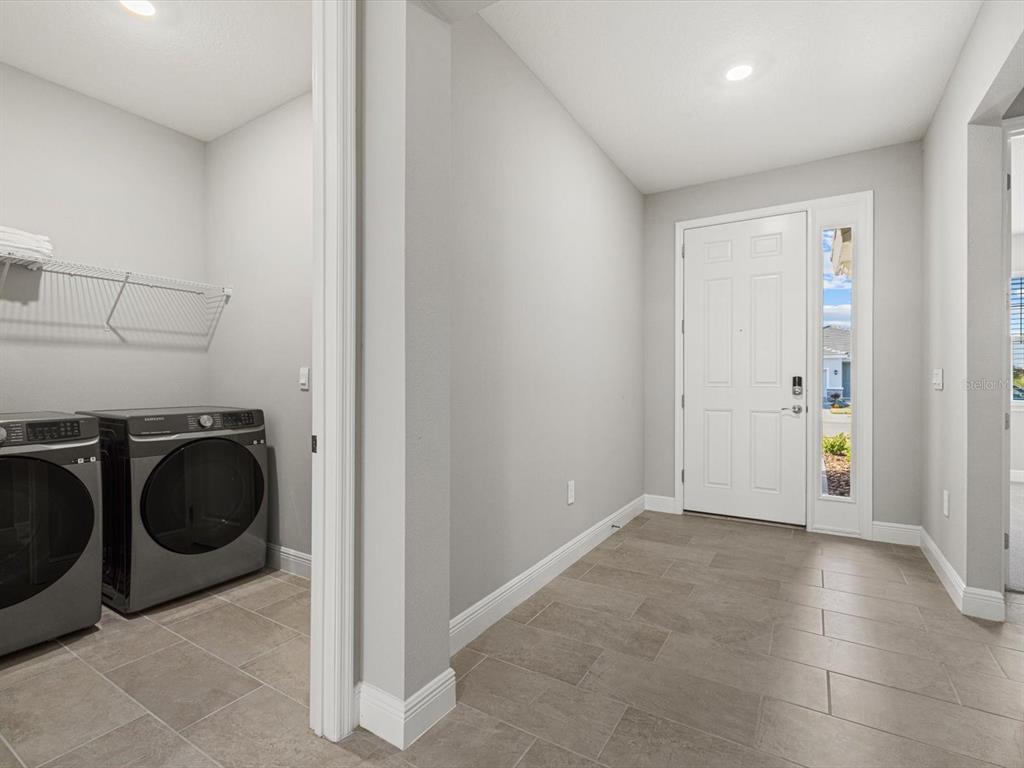 17707 Gulf Rnch Place Bradenton, FL 34211 - Photo 25 of 27 a view of a storage & utility room with washer and dryer