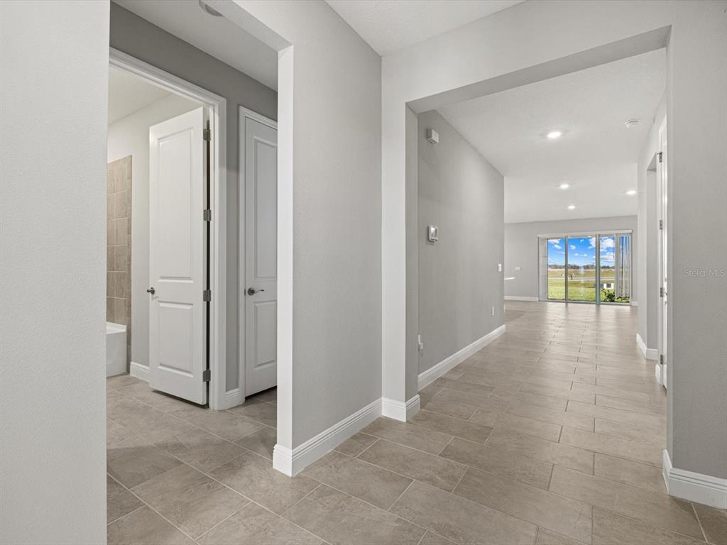 17707 Gulf Rnch Place Bradenton, FL 34211 - Photo 7 of 27 a view of a hallway with wooden shelves