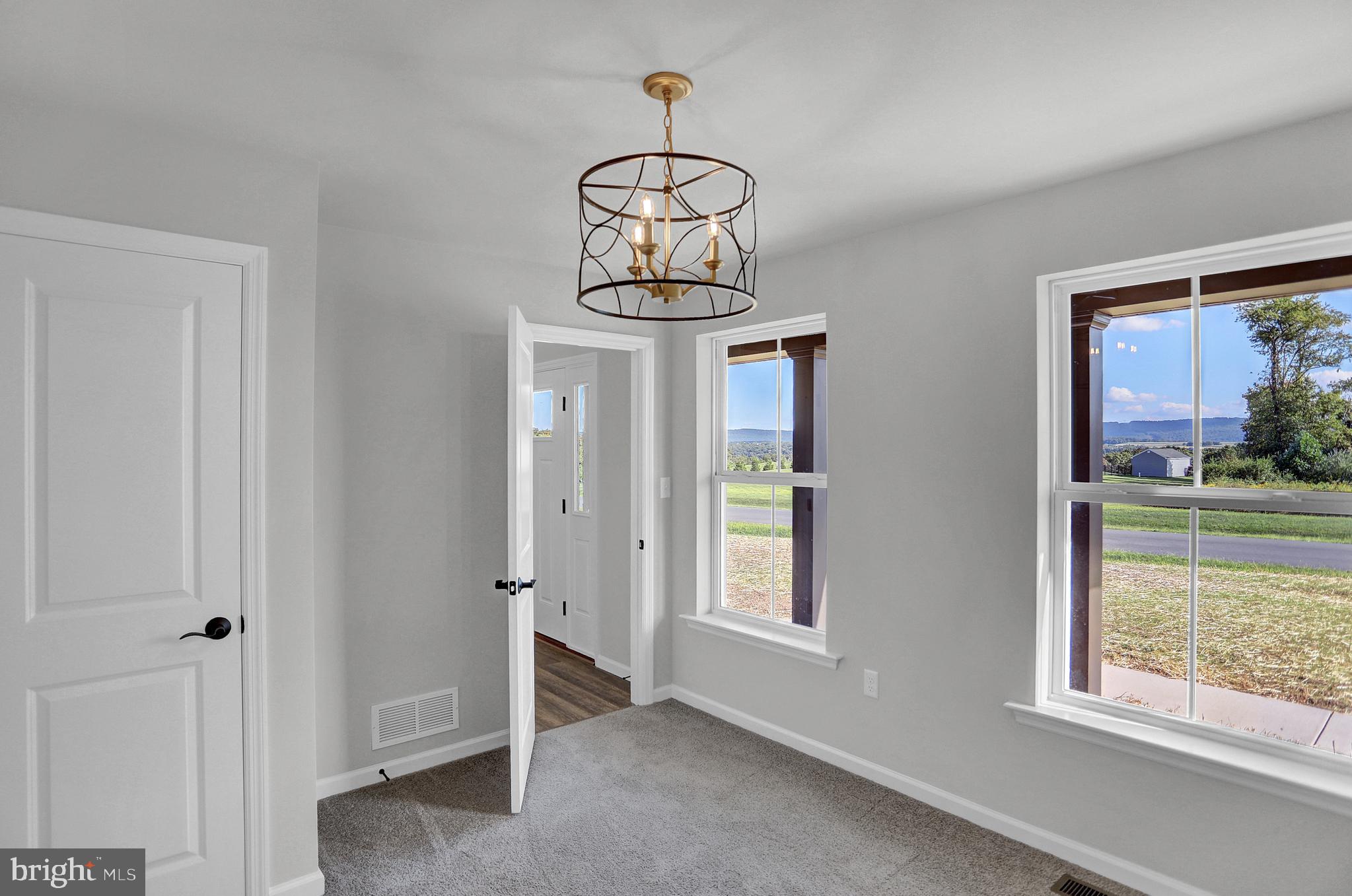 58 Pine Tree Drive Duncannon, PA 17020 - Photo 13 of 53 a room with a window and a chandelier