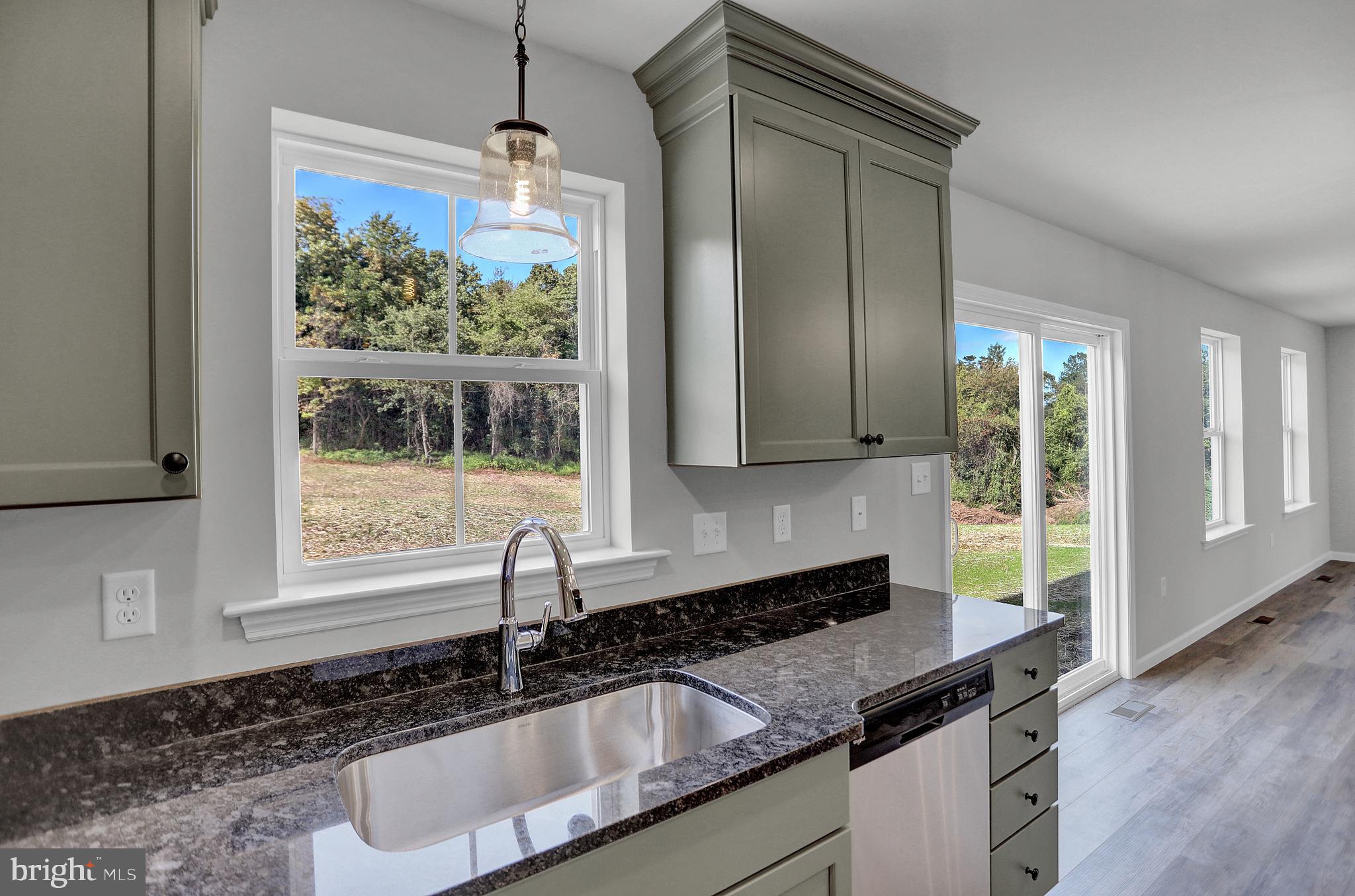 58 Pine Tree Drive Duncannon, PA 17020 - Photo 14 of 53 a kitchen with granite countertop a sink and a window