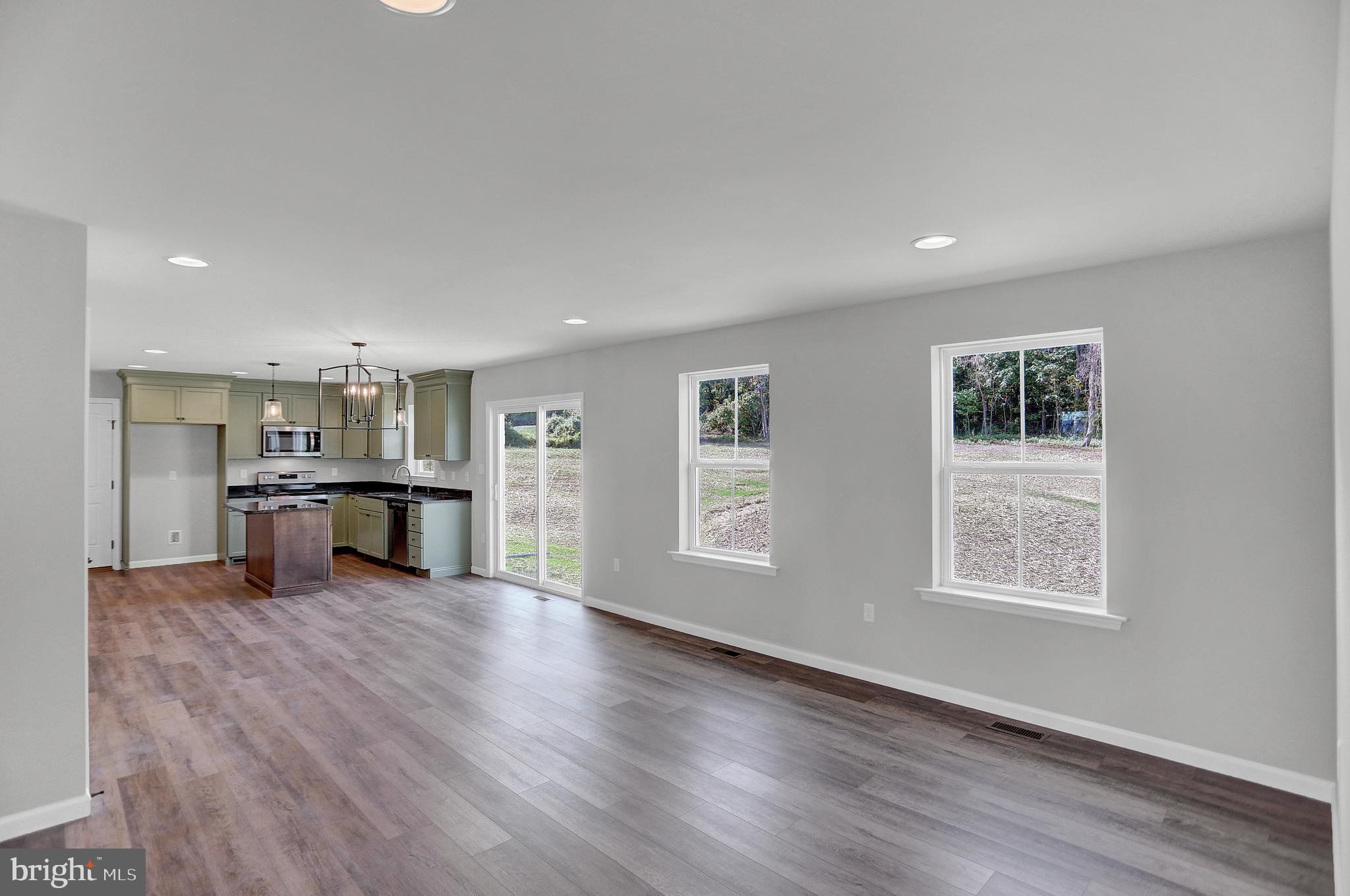 58 Pine Tree Drive Duncannon, PA 17020 - Photo 19 of 53 a view of an empty room with window and wooden floor