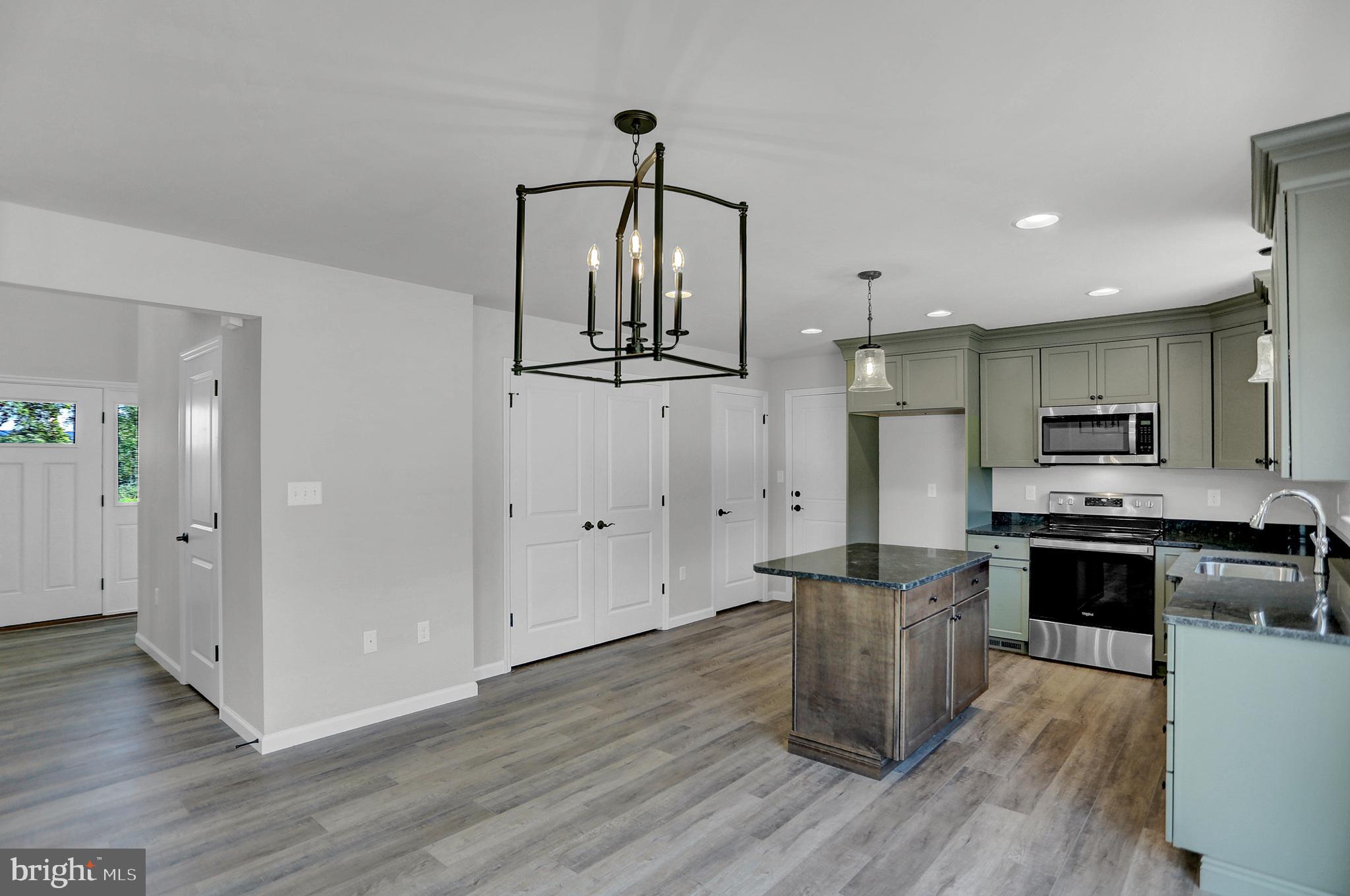 58 Pine Tree Drive Duncannon, PA 17020 - Photo 20 of 53 a kitchen with stainless steel appliances a refrigerator and a stove top oven