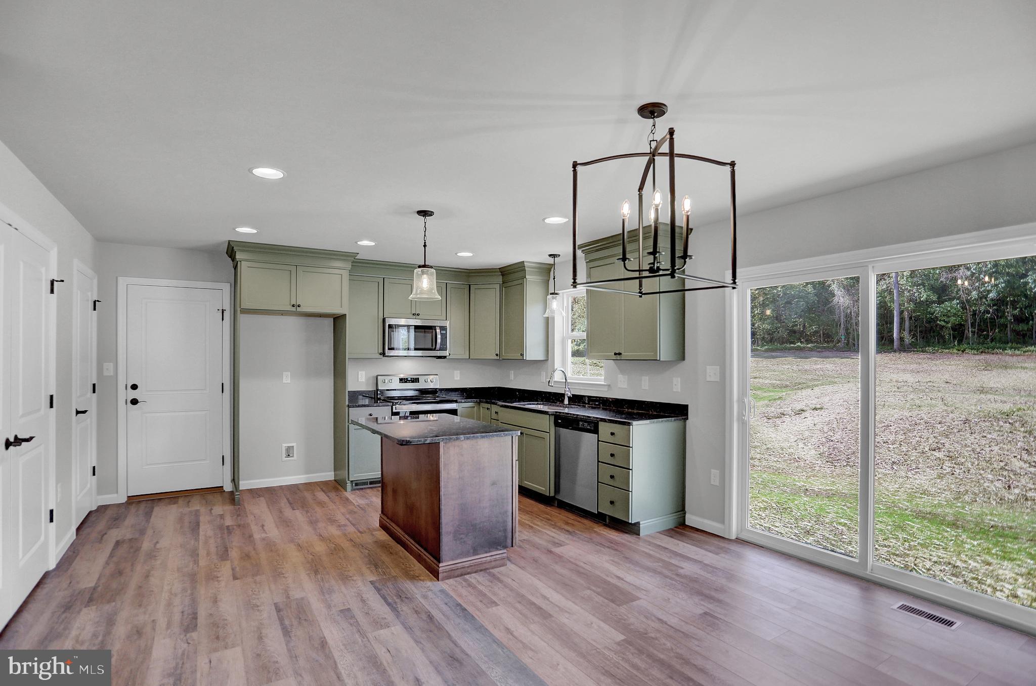 58 Pine Tree Drive Duncannon, PA 17020 - Photo 22 of 53 a kitchen with stainless steel appliances granite countertop a stove and a refrigerator