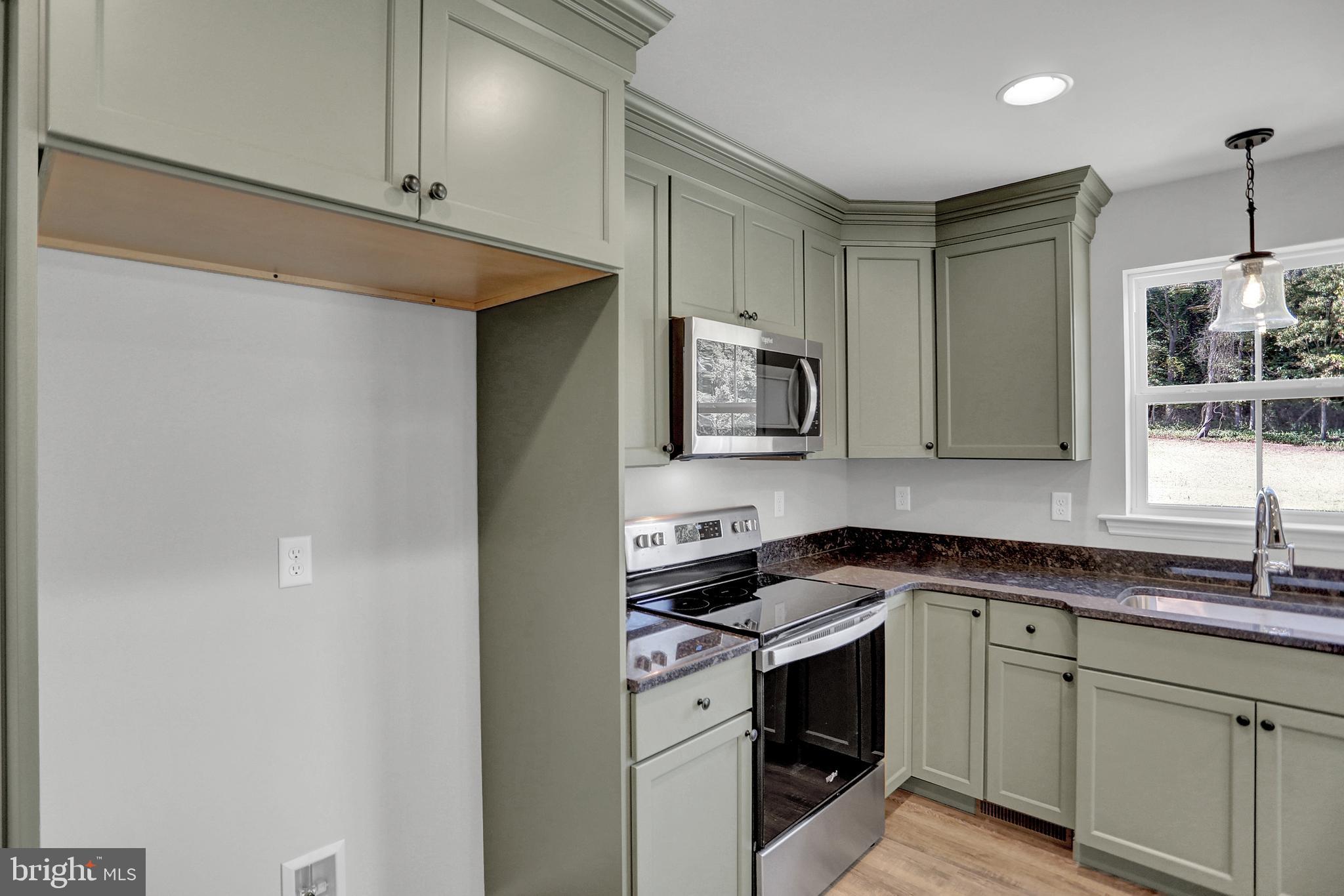 58 Pine Tree Drive Duncannon, PA 17020 - Photo 24 of 53 a kitchen with stainless steel appliances granite countertop a sink and a stove