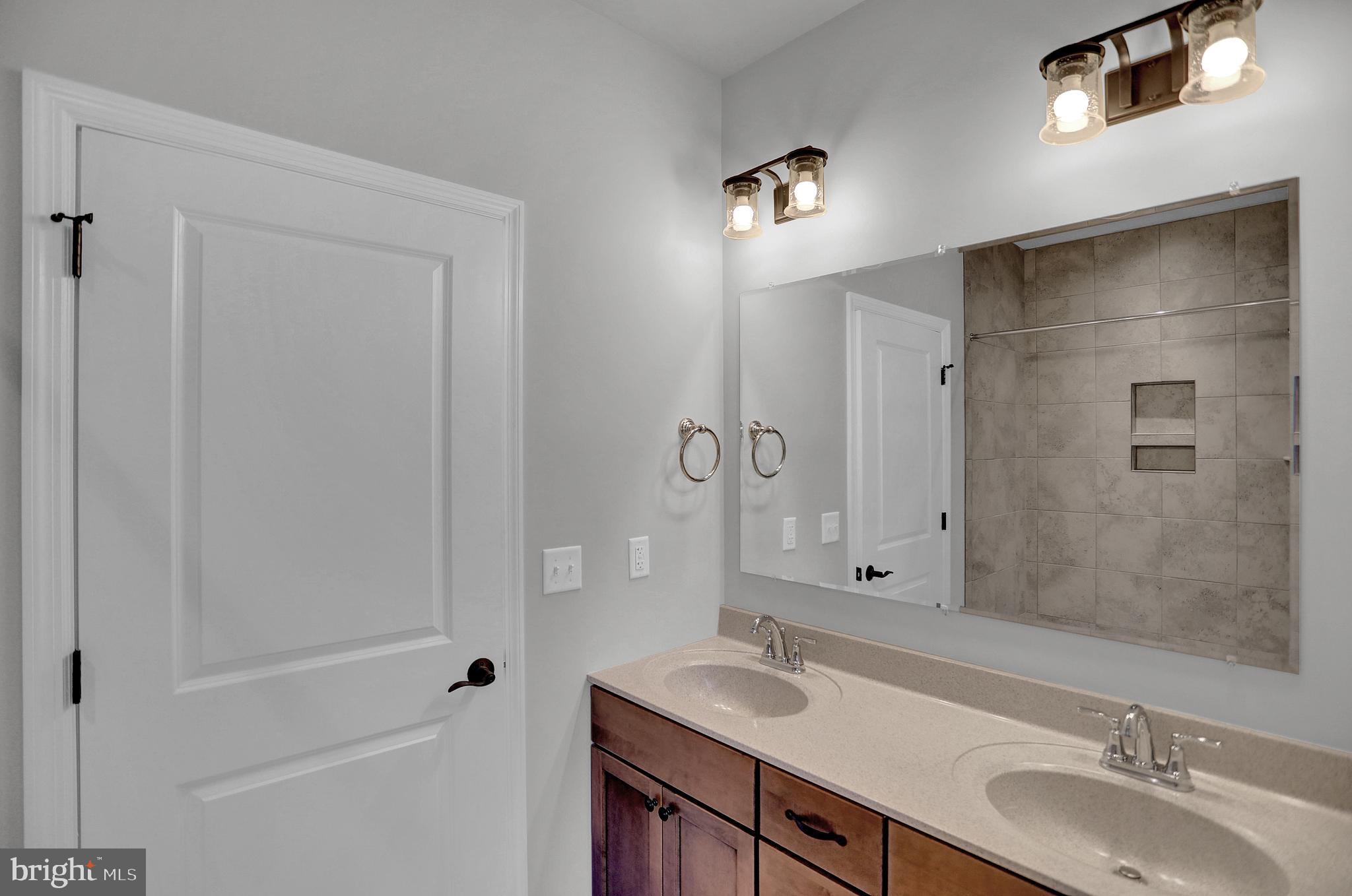 58 Pine Tree Drive Duncannon, PA 17020 - Photo 26 of 53 a bathroom with a double vanity sink mirror double and shower