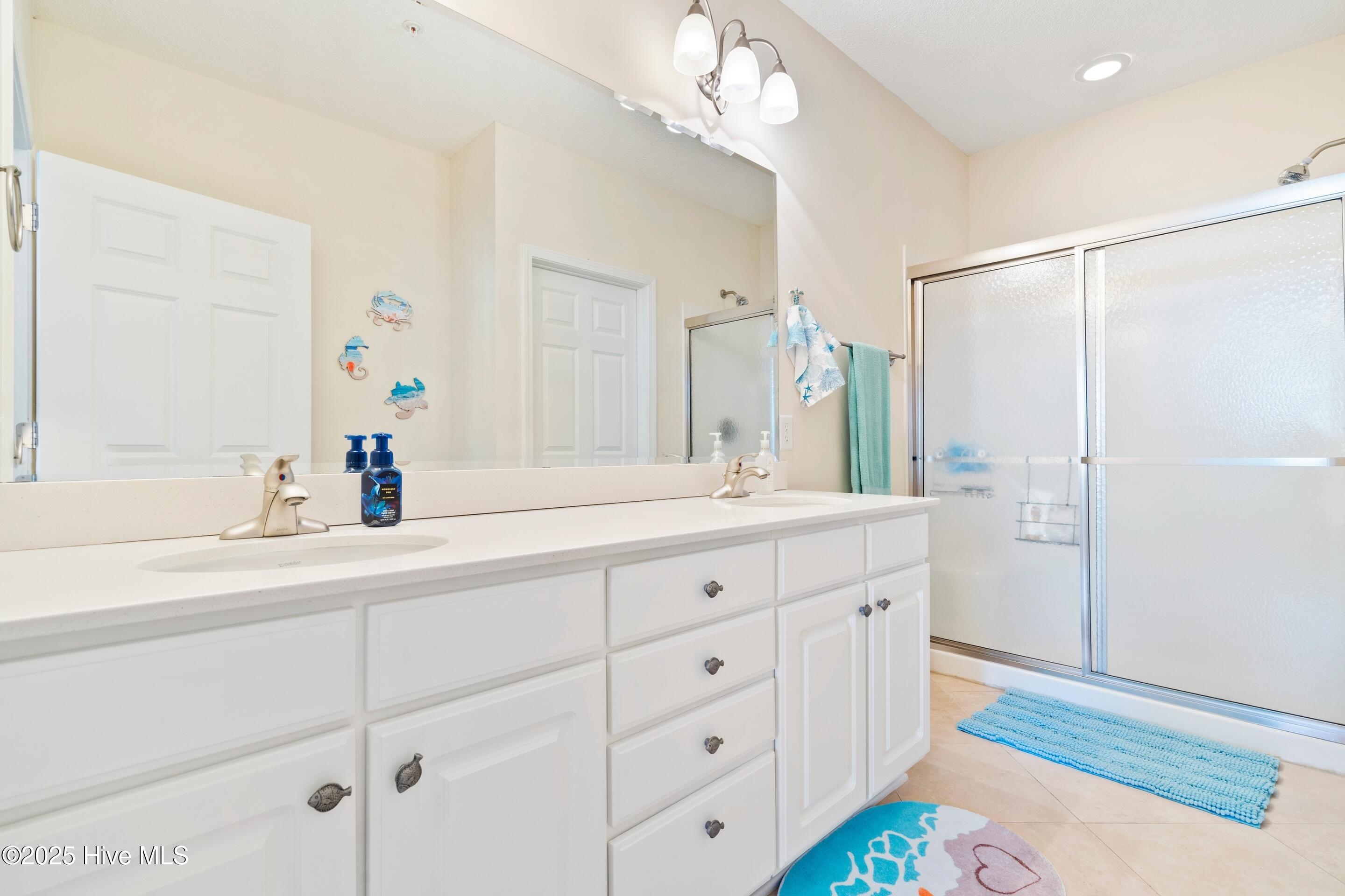 1135 Park Road Southwest, Unit 2304 Sunset Beach, NC 28468 - Photo 21 of 45 Shower and double sink vanity