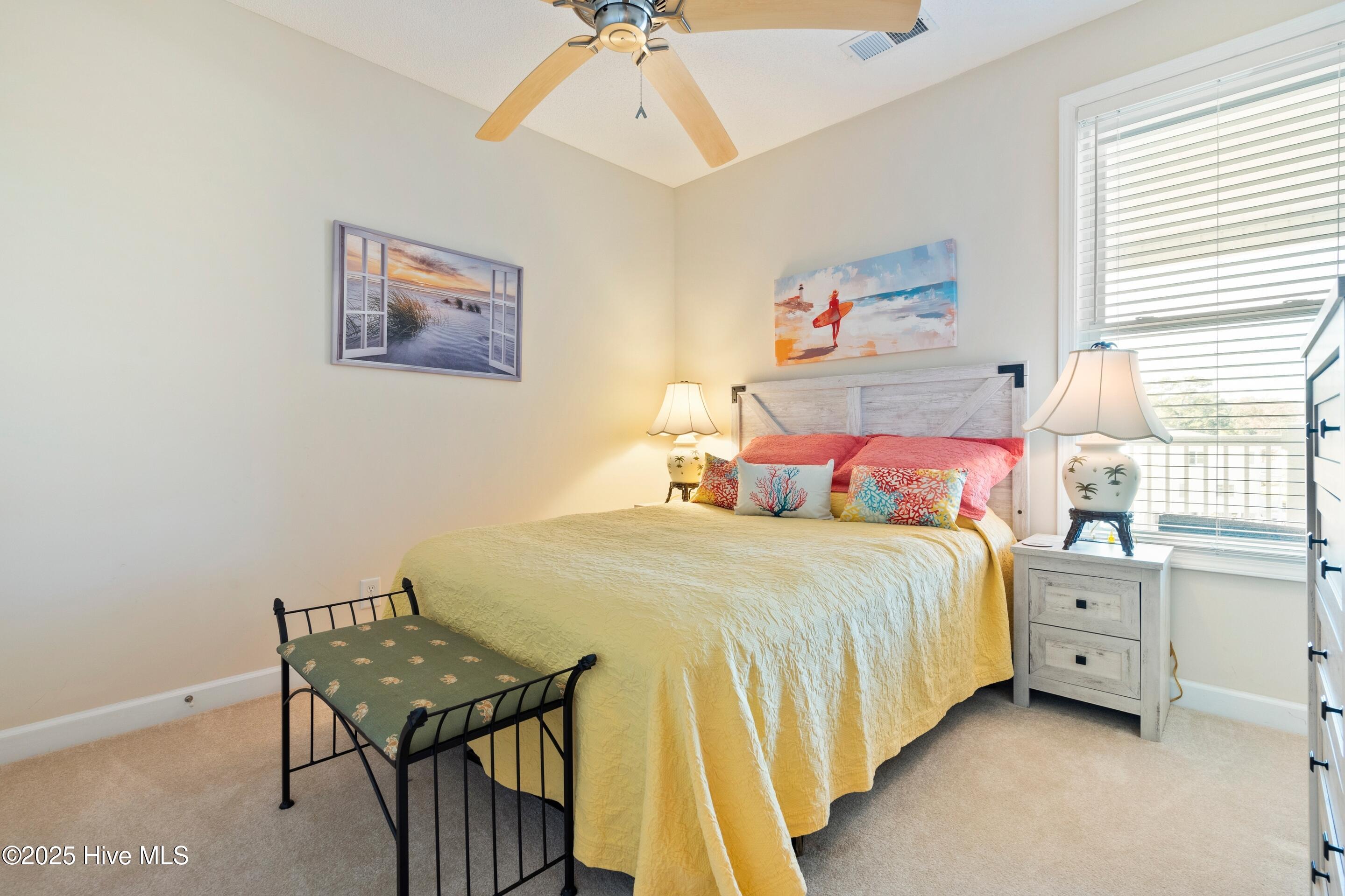 1135 Park Road Southwest, Unit 2304 Sunset Beach, NC 28468 - Photo 27 of 45 Guest bedroom 1 - fan, light and carpeted