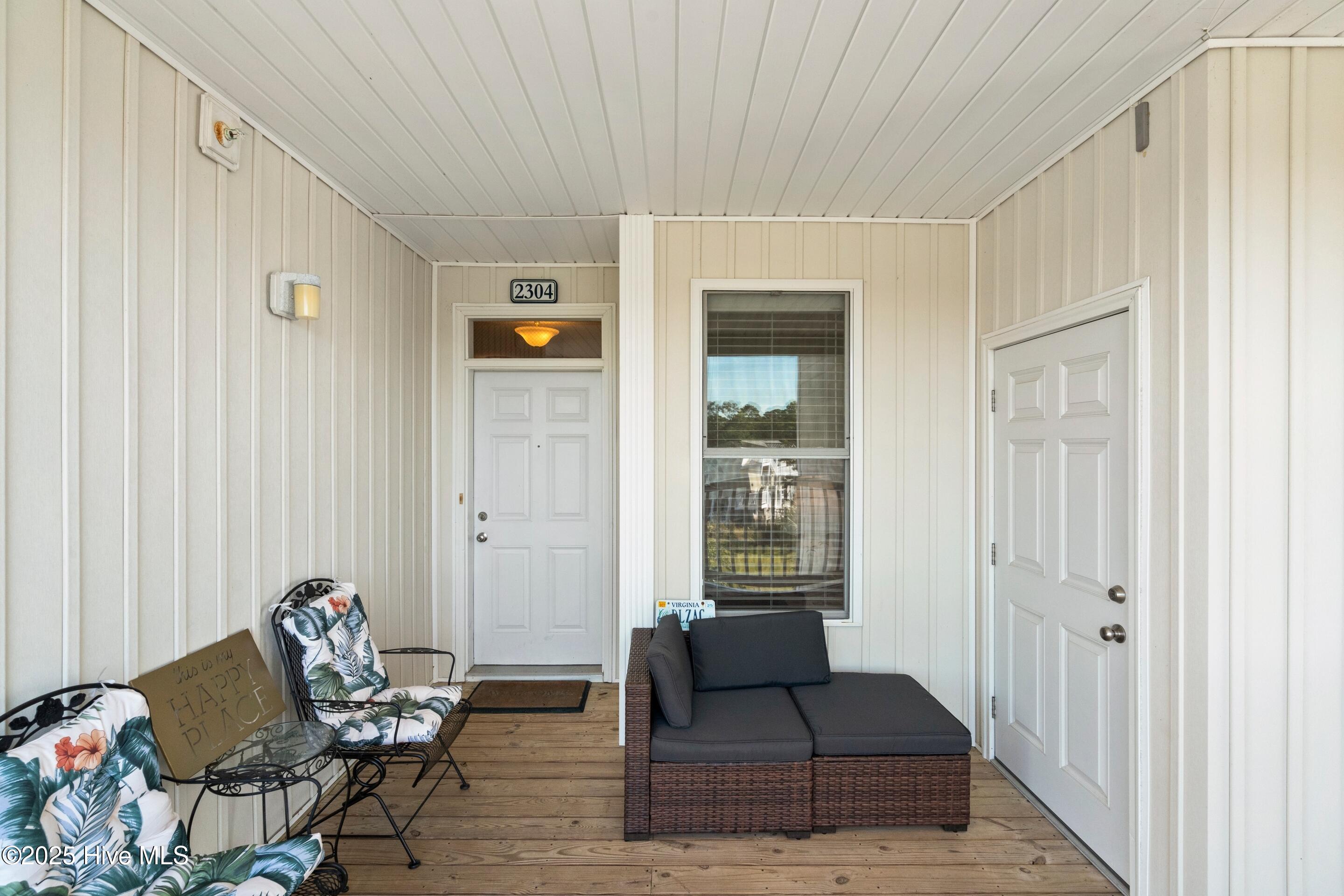 1135 Park Road Southwest, Unit 2304 Sunset Beach, NC 28468 - Photo 3 of 45 Sitting area at front door