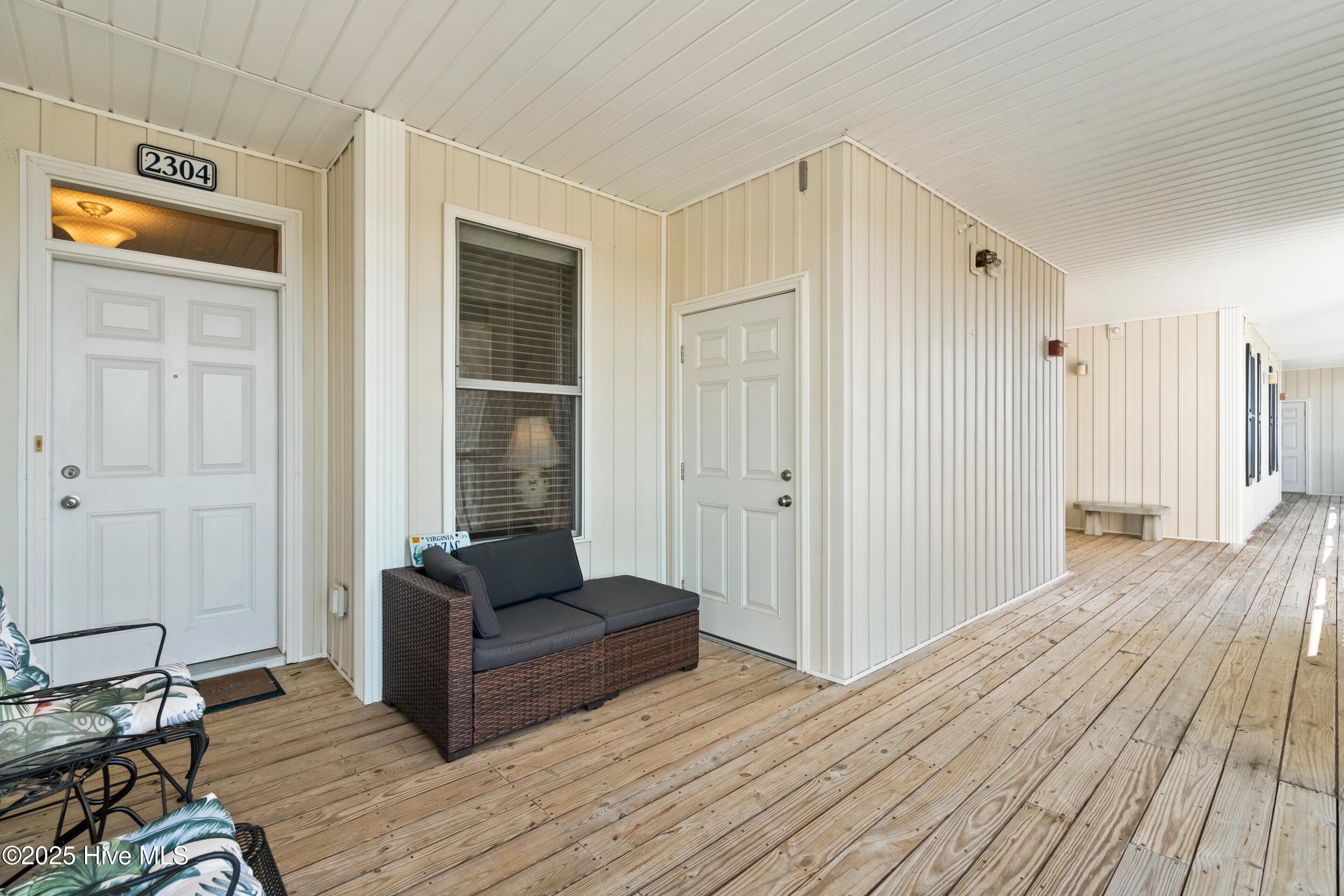 1135 Park Road Southwest, Unit 2304 Sunset Beach, NC 28468 - Photo 5 of 45 Storage door on the right for all your beach toys!