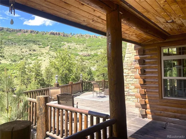 a view of a chair and tables in the porch