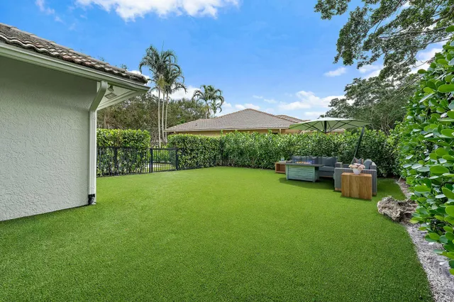 a view of a backyard with a garden and plants