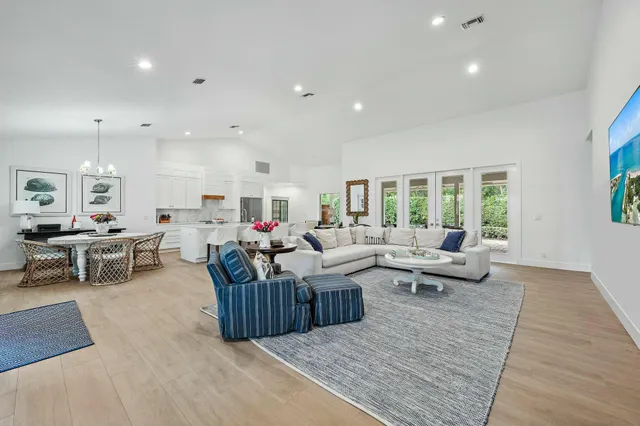 a living room with lots of furniture and a rug