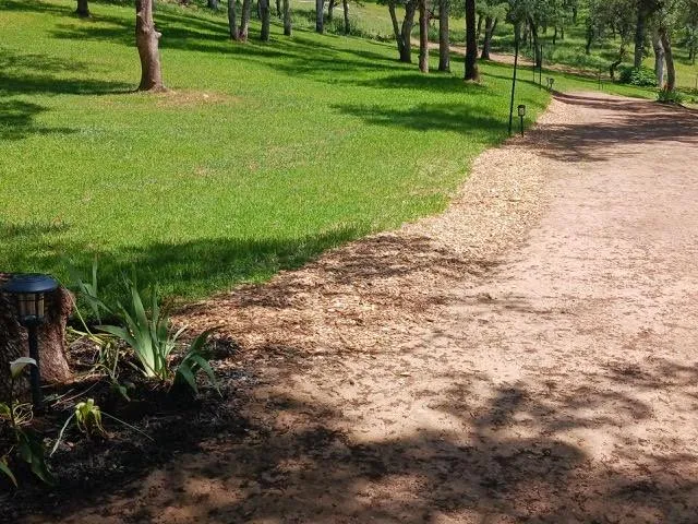 a view of a backyard with table and chairs and a fire pit