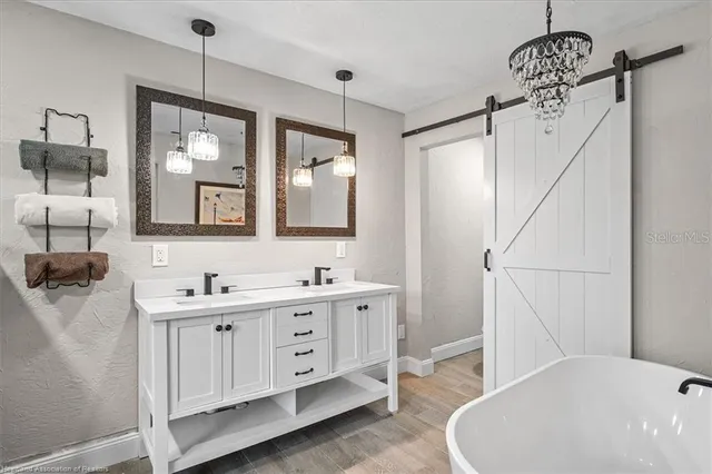 a bathroom with a sink a toilet and mirror