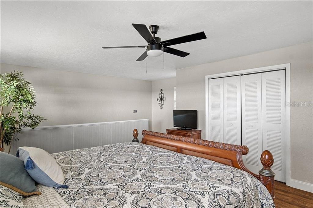 564 Lake June Road Lake Placid, FL 33852 - Photo 28 of 49 a bedroom with a bed and a window