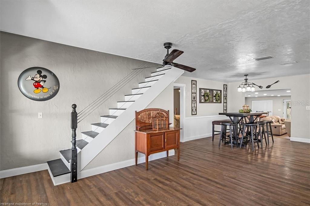 564 Lake June Road Lake Placid, FL 33852 - Photo 31 of 49 a living room with furniture and a wooden floor