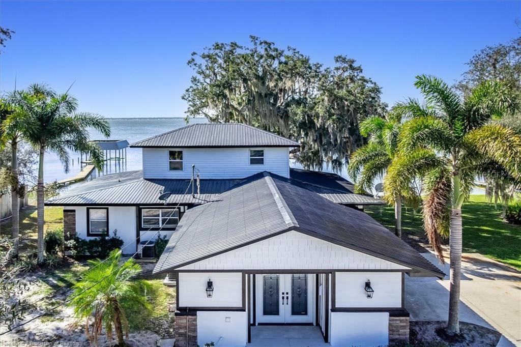 564 Lake June Road Lake Placid, FL 33852 - Photo 6 of 49 a house with trees in the background