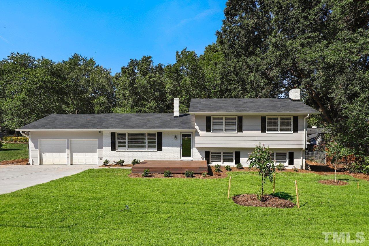 5309 Falls Of Neuse Road Raleigh, NC 27609 - Photo 1 of 38 a front view of house with a garden and patio