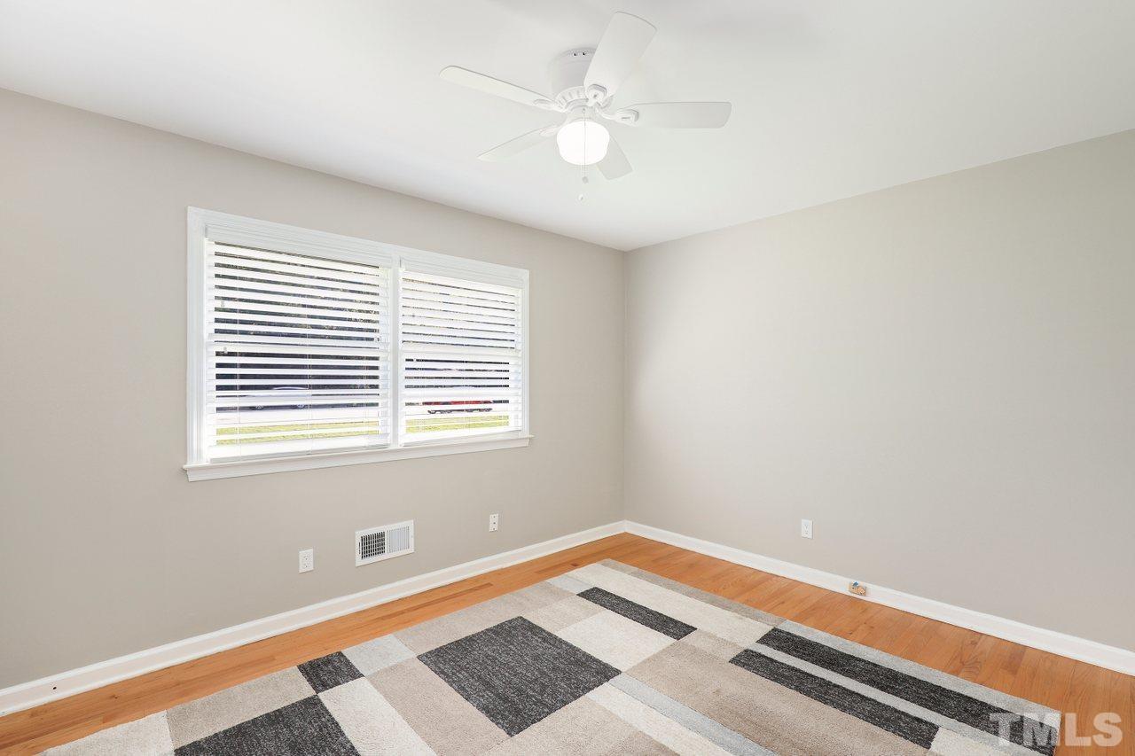 5309 Falls Of Neuse Road Raleigh, NC 27609 - Photo 14 of 38 a room with a bed and a window