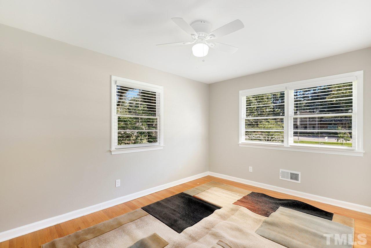 5309 Falls Of Neuse Road Raleigh, NC 27609 - Photo 19 of 38 a bedroom with a bed and a window