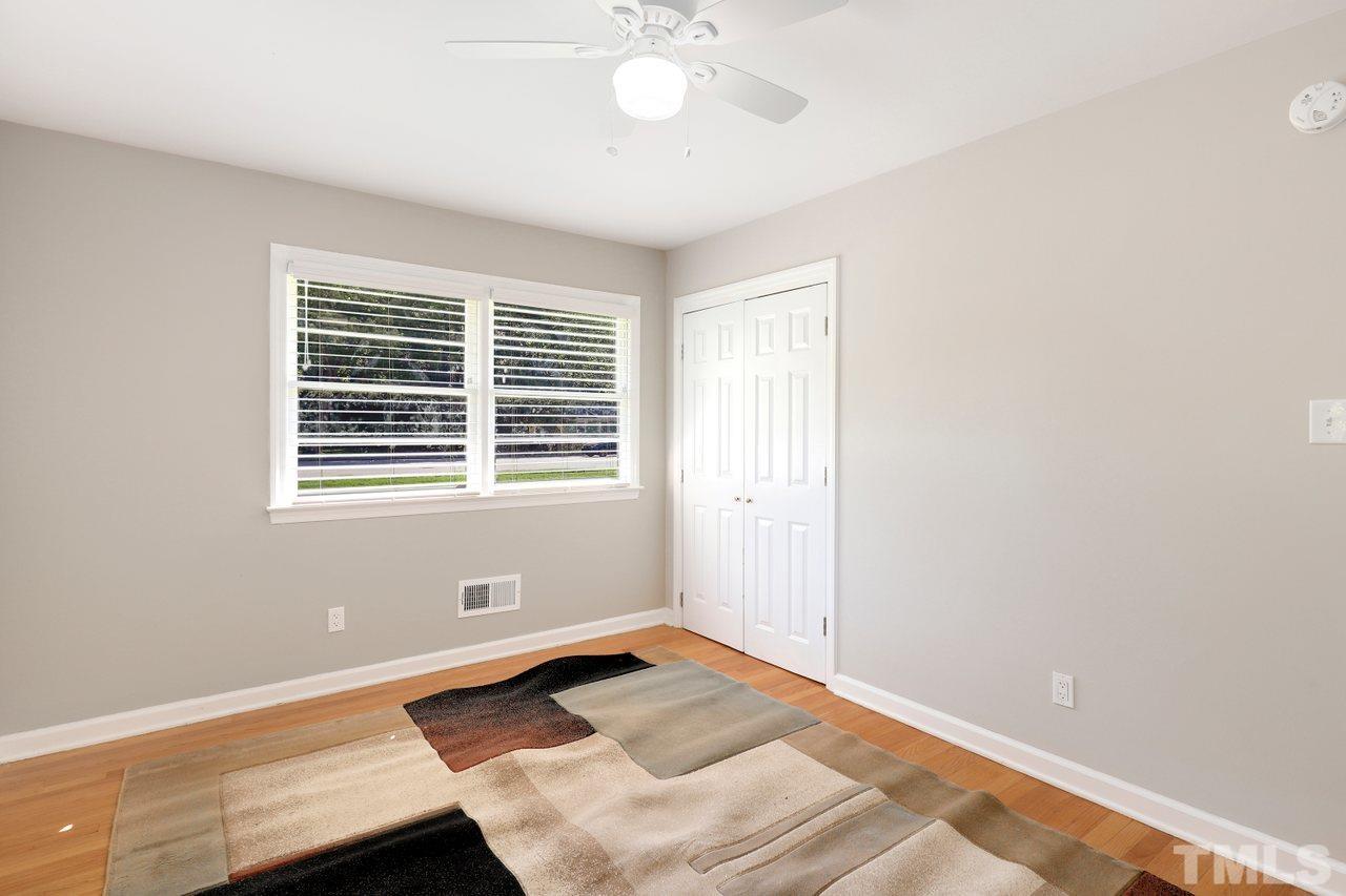 5309 Falls Of Neuse Road Raleigh, NC 27609 - Photo 20 of 38 a view of wooden floor and chandelier fan in a room