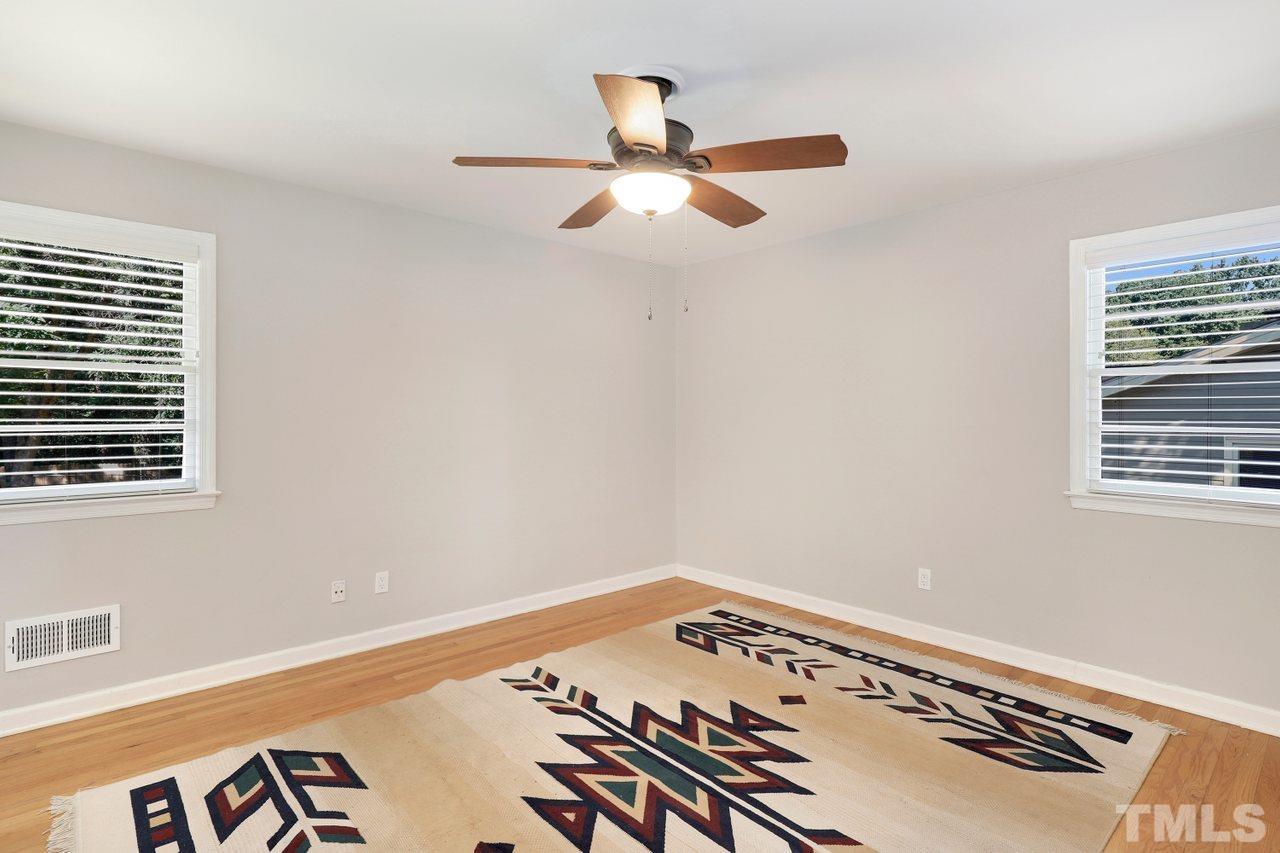 5309 Falls Of Neuse Road Raleigh, NC 27609 - Photo 21 of 38 a view of a room with a ceiling fan and a window