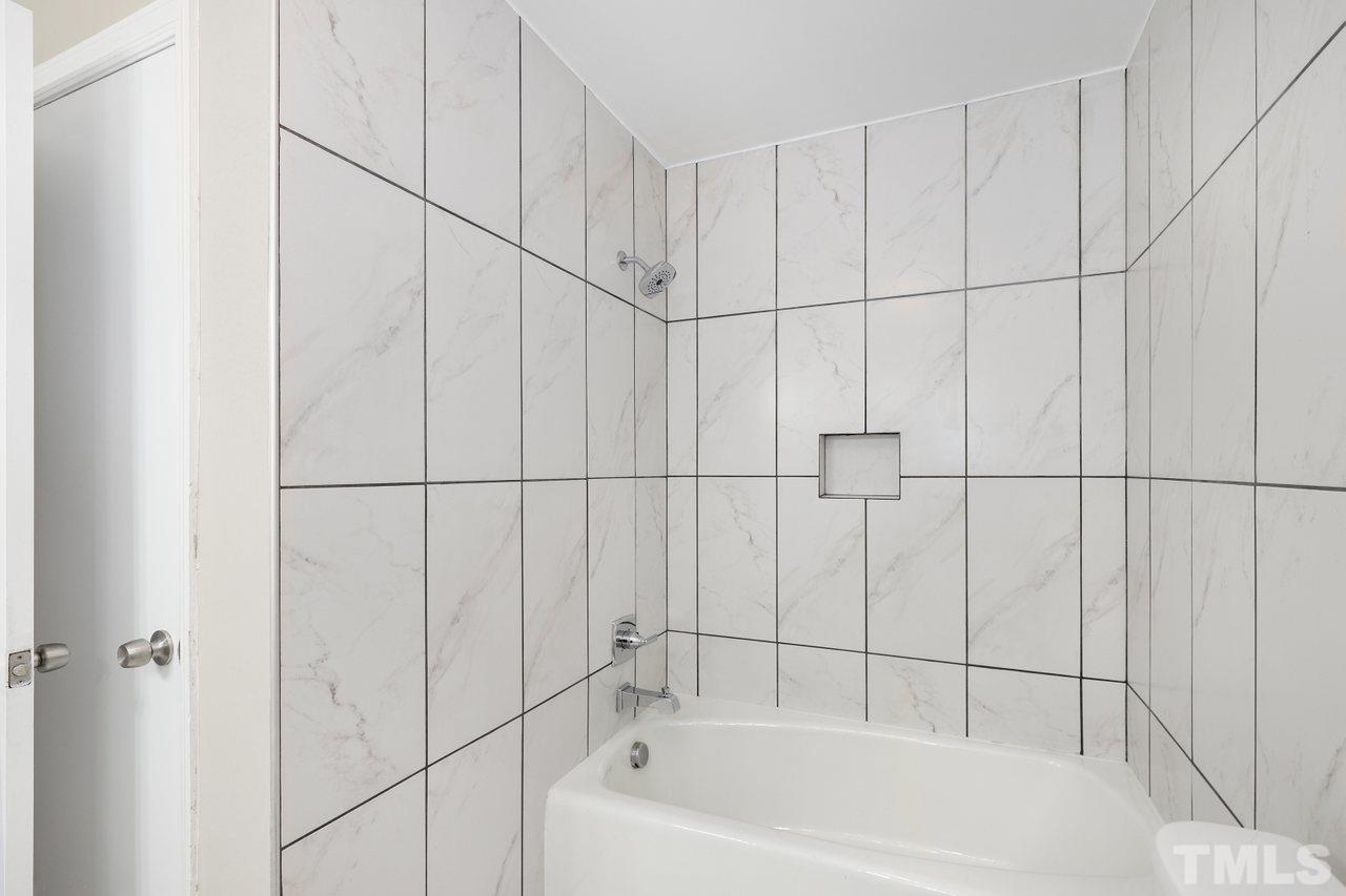 5309 Falls Of Neuse Road Raleigh, NC 27609 - Photo 24 of 38 a bathroom with a bathtub