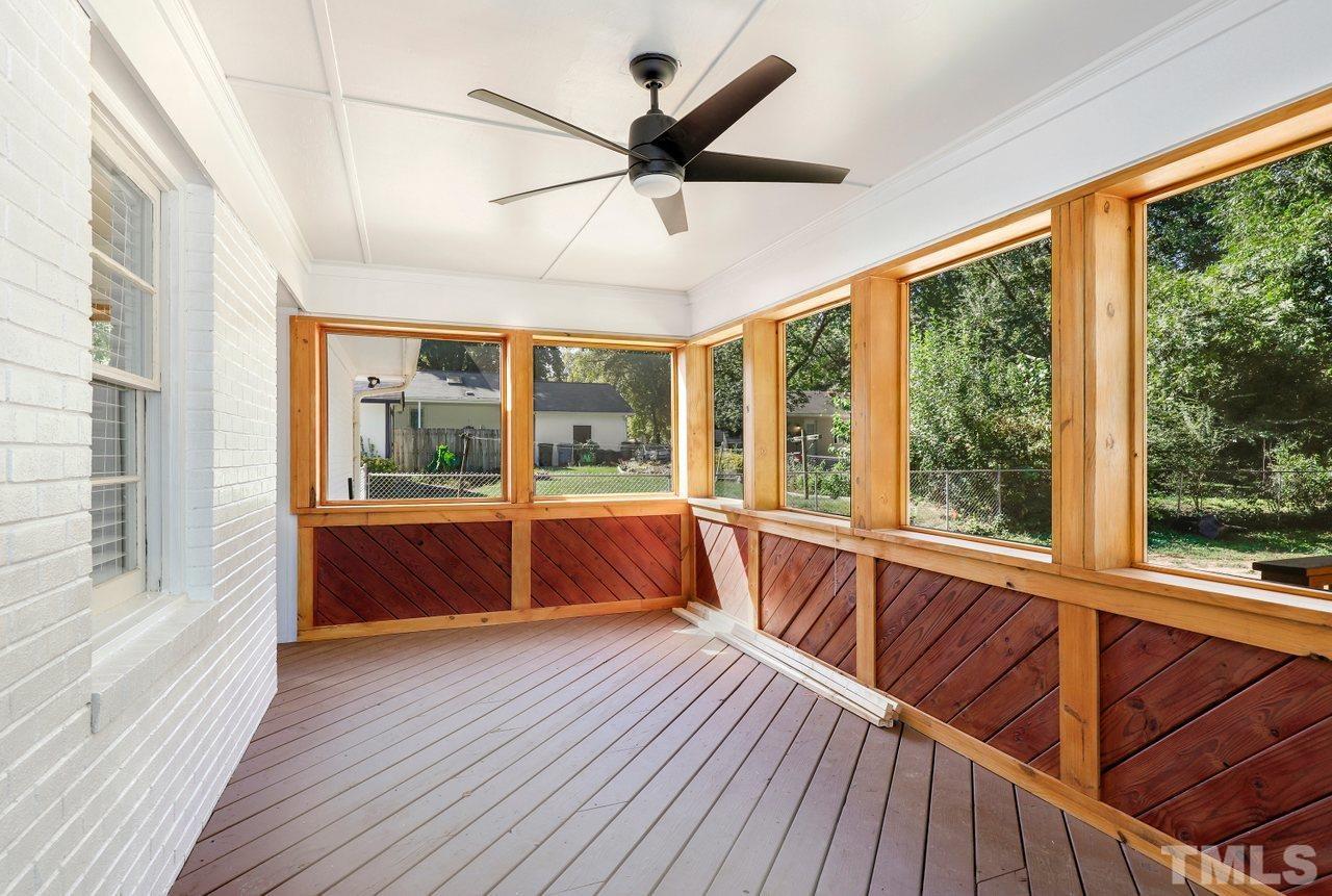 5309 Falls Of Neuse Road Raleigh, NC 27609 - Photo 33 of 38 a view of an empty room with wooden floor and a window