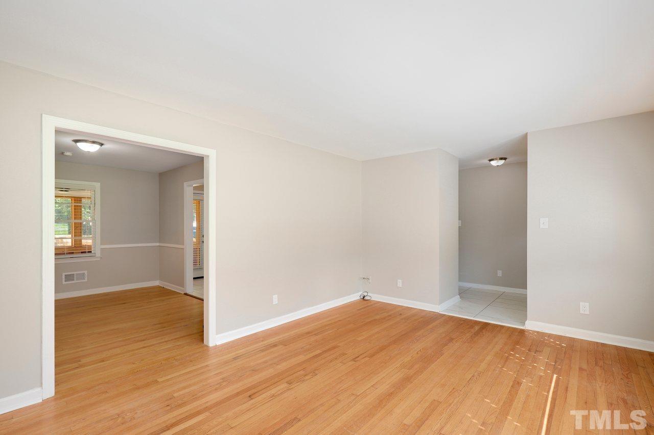 5309 Falls Of Neuse Road Raleigh, NC 27609 - Photo 6 of 38 a view of a room with wooden floor and a bathroom