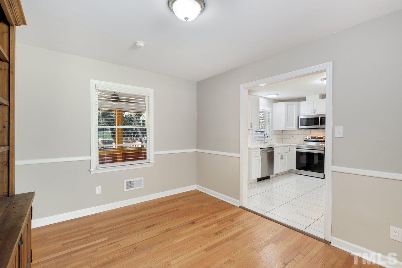 5309 Falls Of Neuse Road Raleigh, NC 27609 - Photo 7 of 38 a view of a kitchen with a sink cabinet and a window