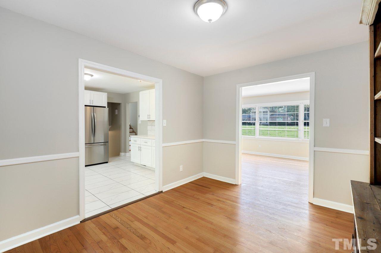 5309 Falls Of Neuse Road Raleigh, NC 27609 - Photo 8 of 38 an empty room with wooden floor and windows