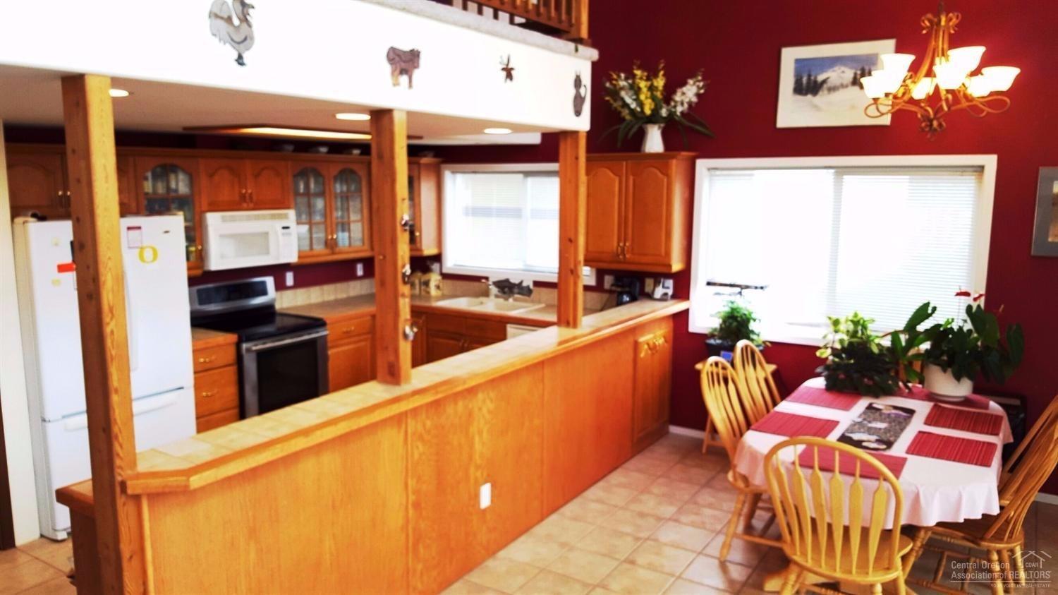 65870 Twin Bridges Road Bend, OR 97703 - Photo 6 of 19 Tiled kitchen with ample cabinetry