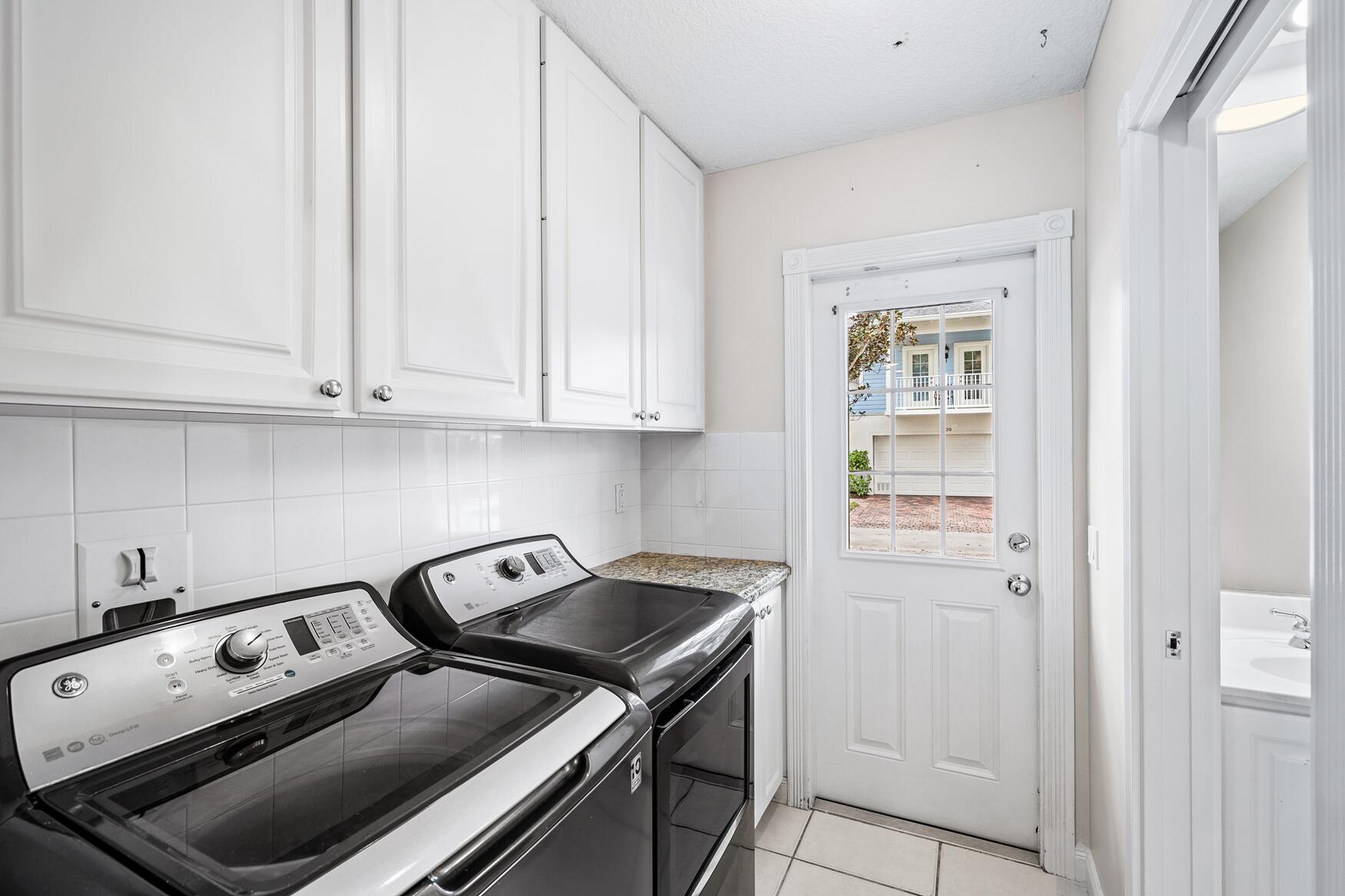 3184 West Community Drive Jupiter, FL 33458 - Photo 14 of 25 a view of a kitchen with appliances and cabinets