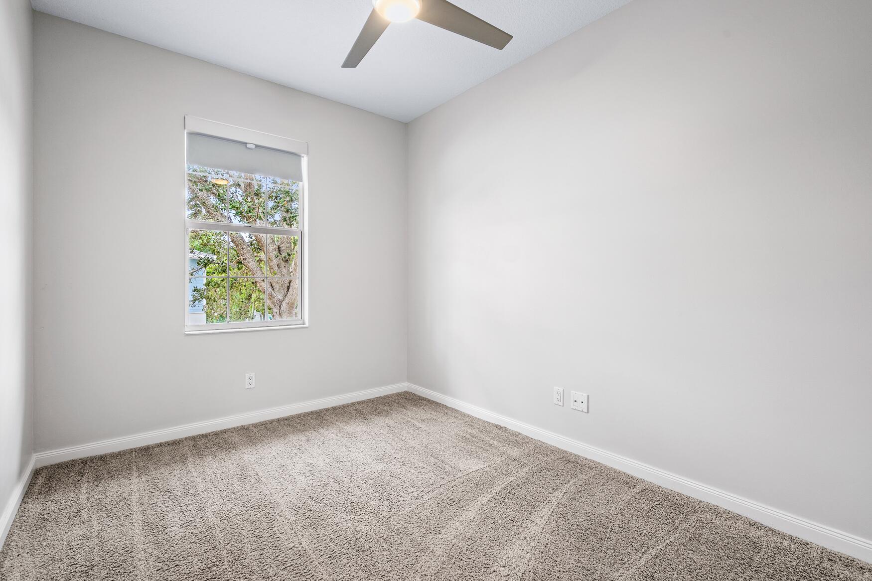 3184 West Community Drive Jupiter, FL 33458 - Photo 16 of 25 an empty room with a window