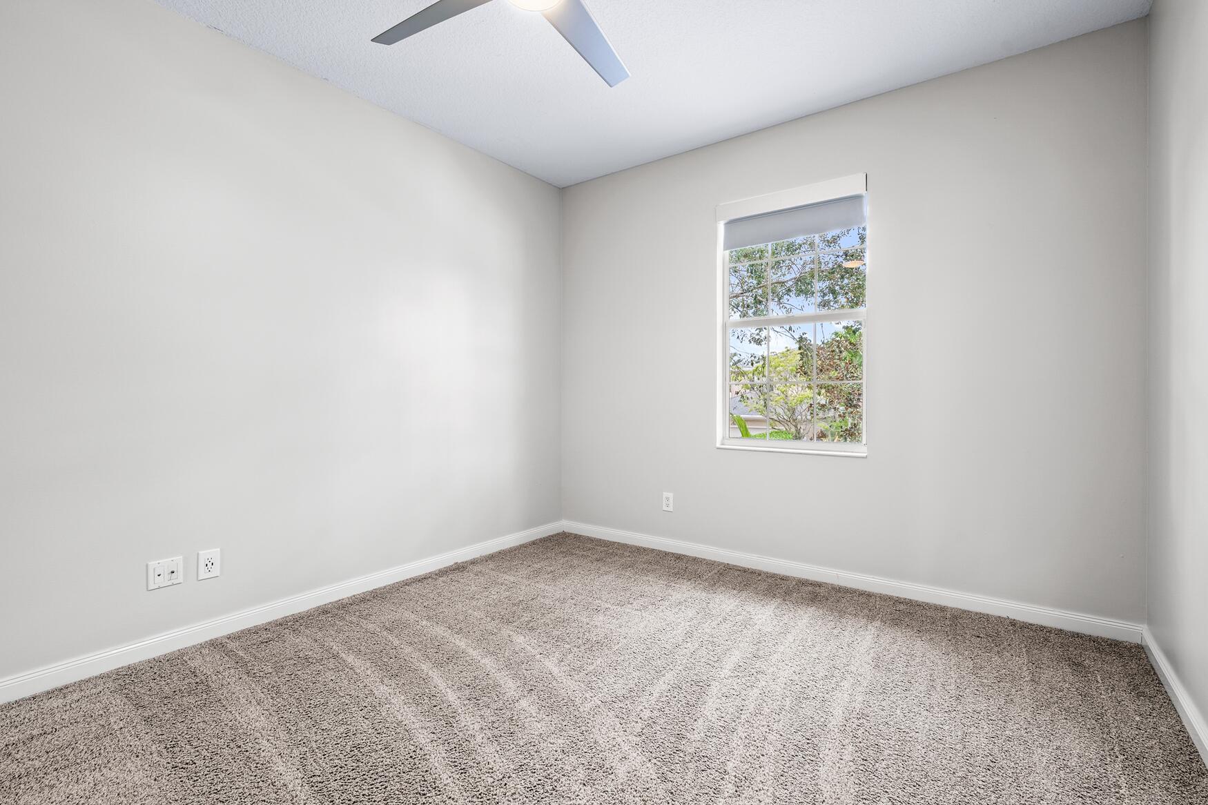 3184 West Community Drive Jupiter, FL 33458 - Photo 17 of 25 an empty room with a window