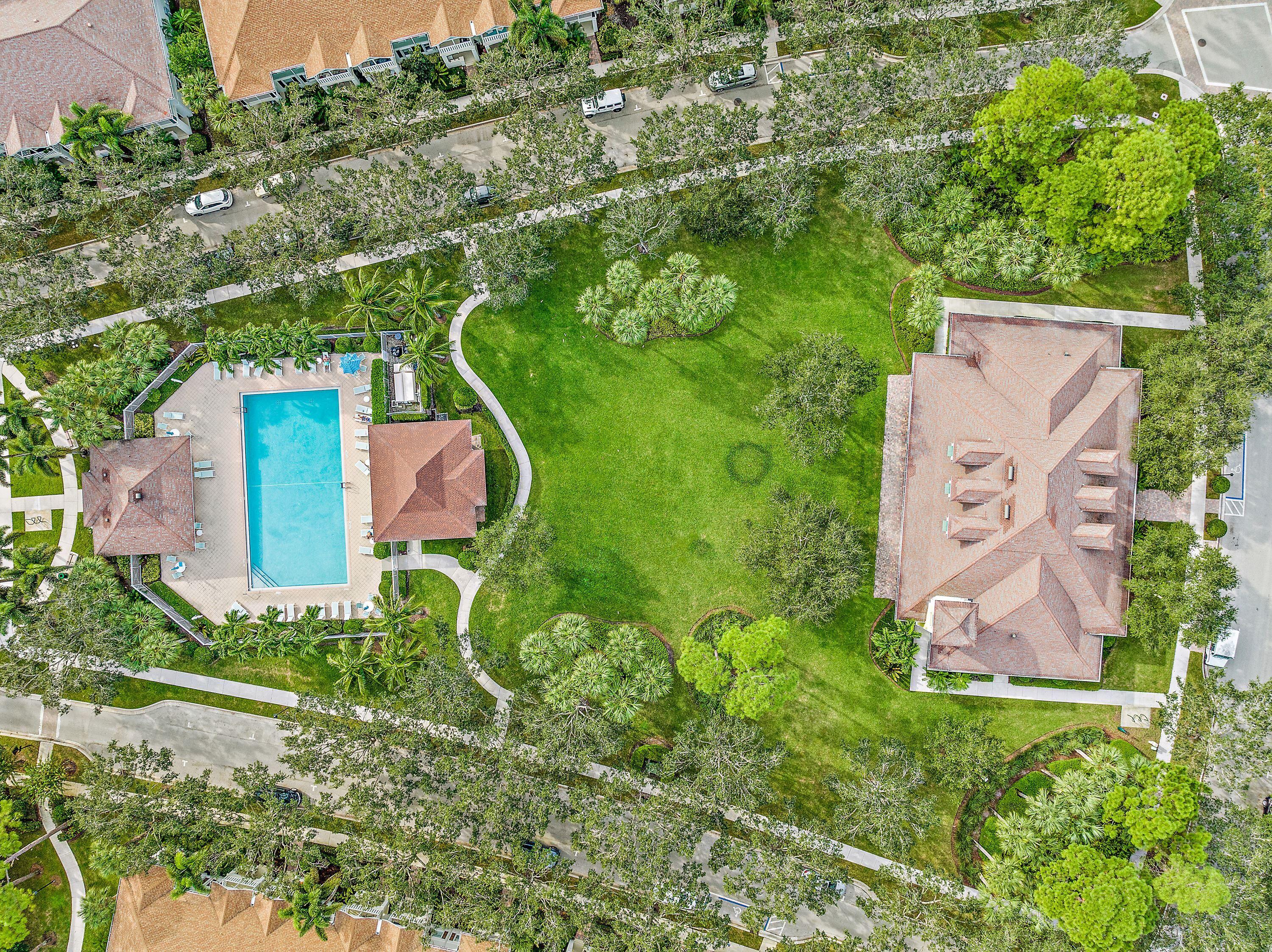 3184 West Community Drive Jupiter, FL 33458 - Photo 4 of 25 an aerial view of residential house with outdoor space and trees all around