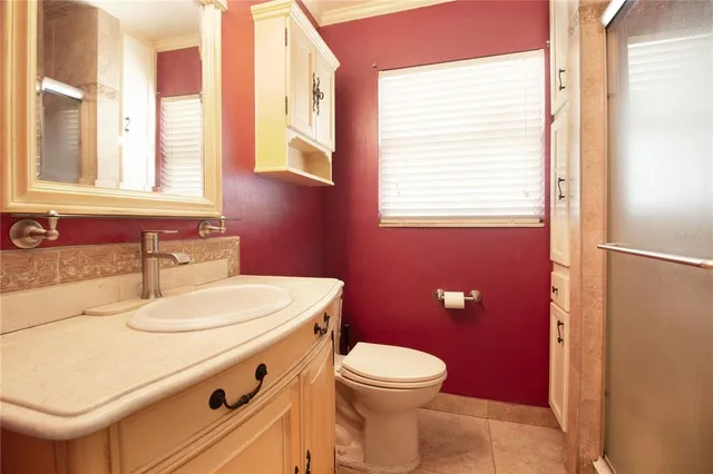 a bathroom with a sink a toilet and tub