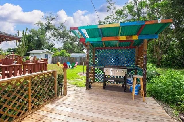 a view of a deck with a table and chairs