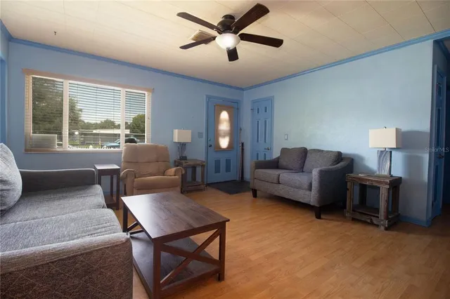 a living room with furniture and a window
