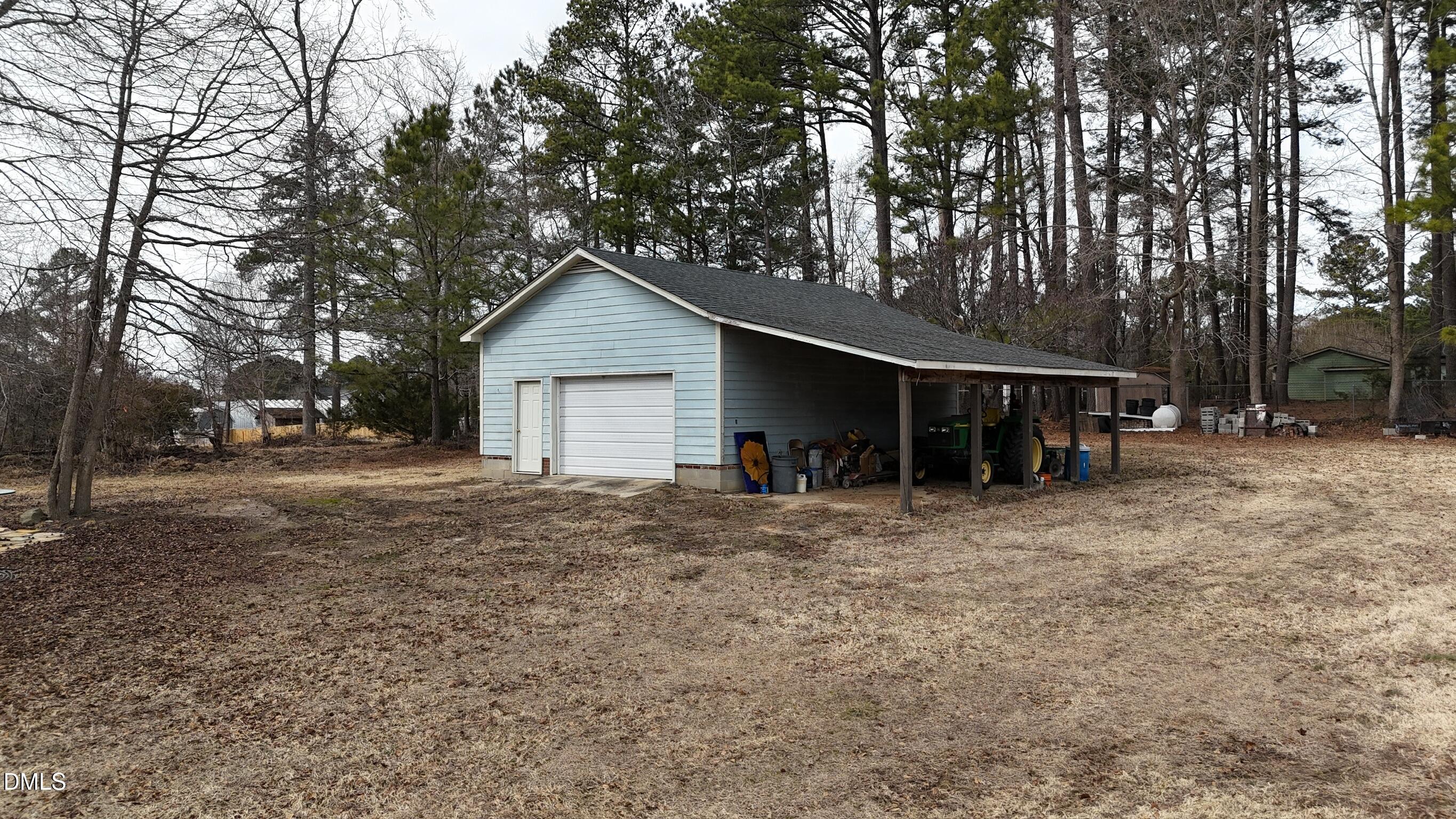0 Pleasants Road Wendell, NC 27591 - Photo 30 of 32 a view of a house with a yard and large trees