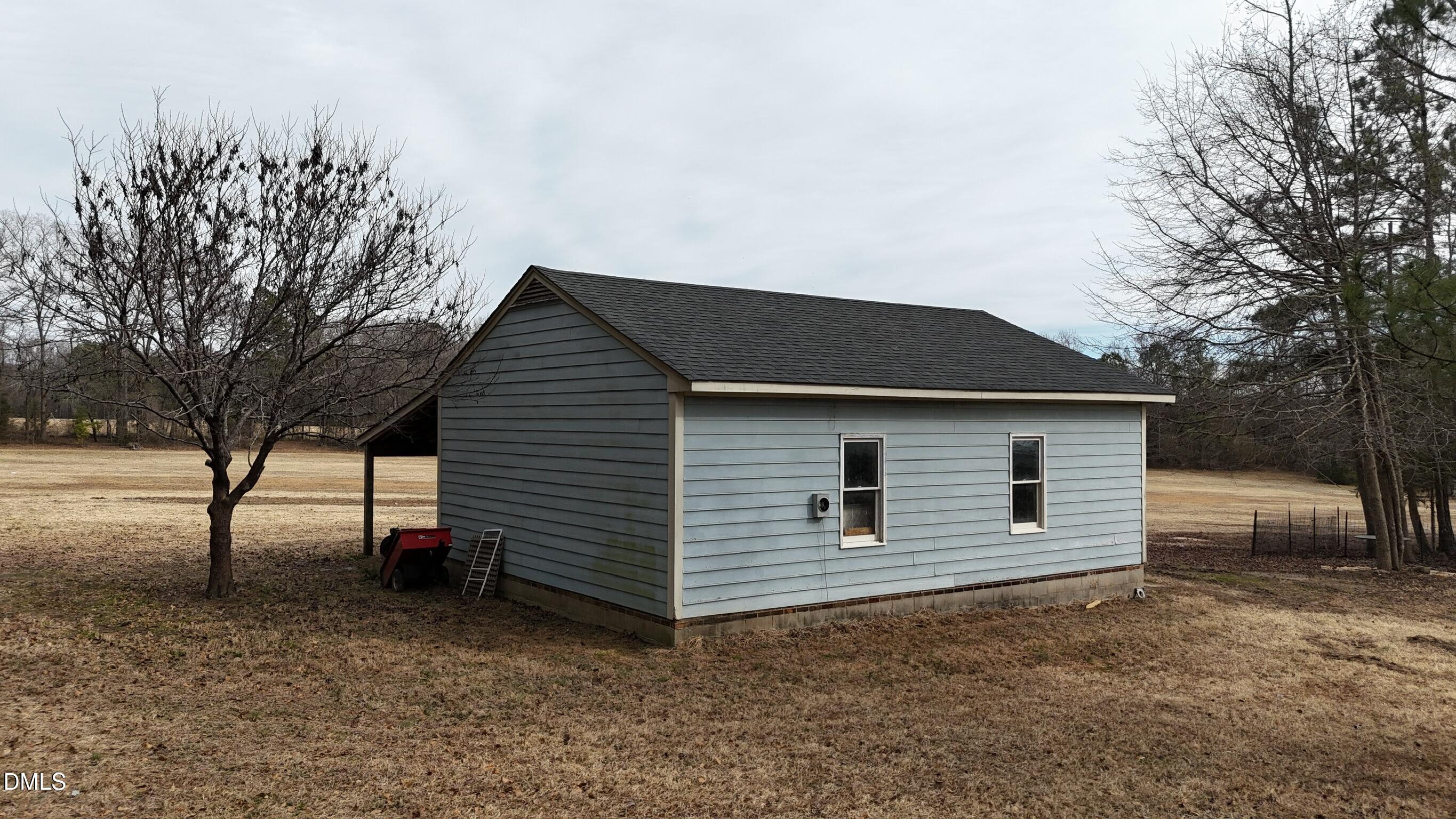0 Pleasants Road Wendell, NC 27591 - Photo 32 of 32 a backyard of a house with garage and yard