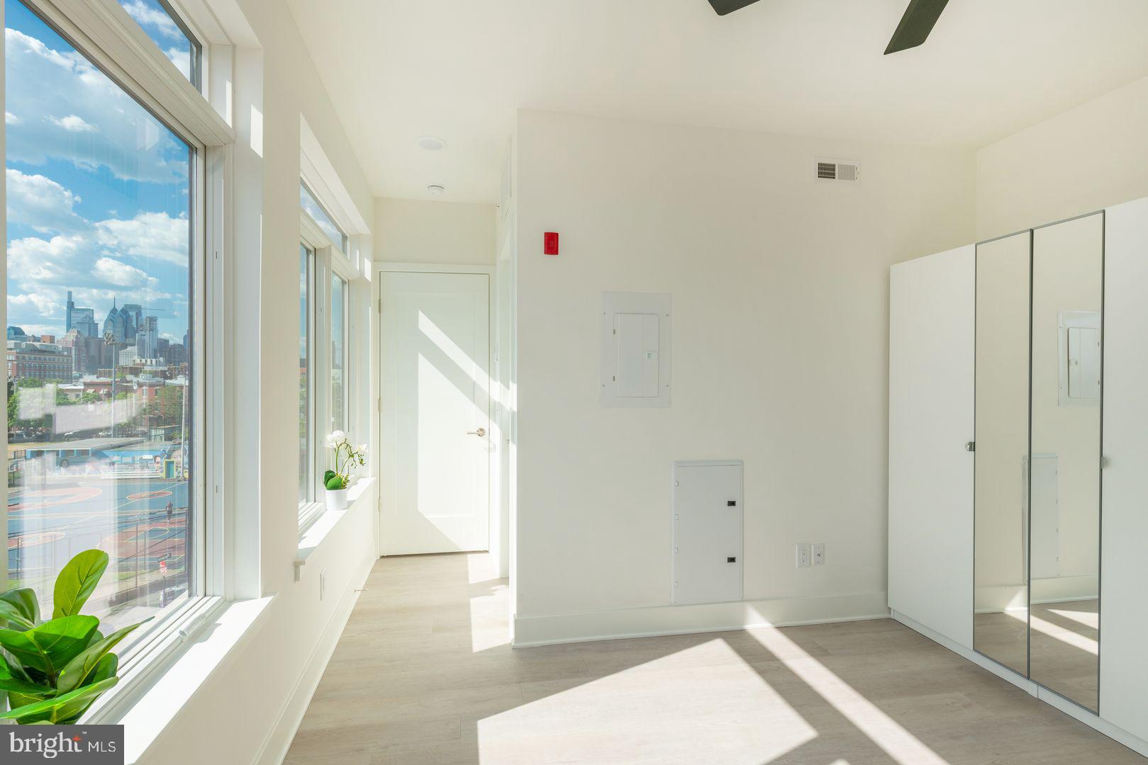 833 Wharton Street, Unit 2B405 Philadelphia, PA 19147 - Photo 12 of 15 a view of an entryway with wooden floor