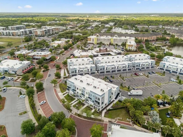 an aerial view of residential building with parking