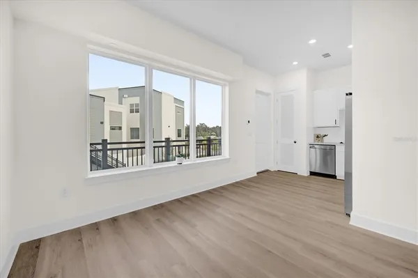 a view of an empty room with a window