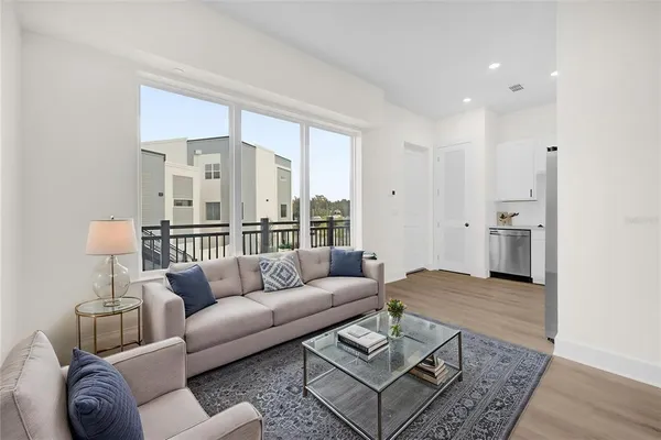 a living room with furniture and a rug